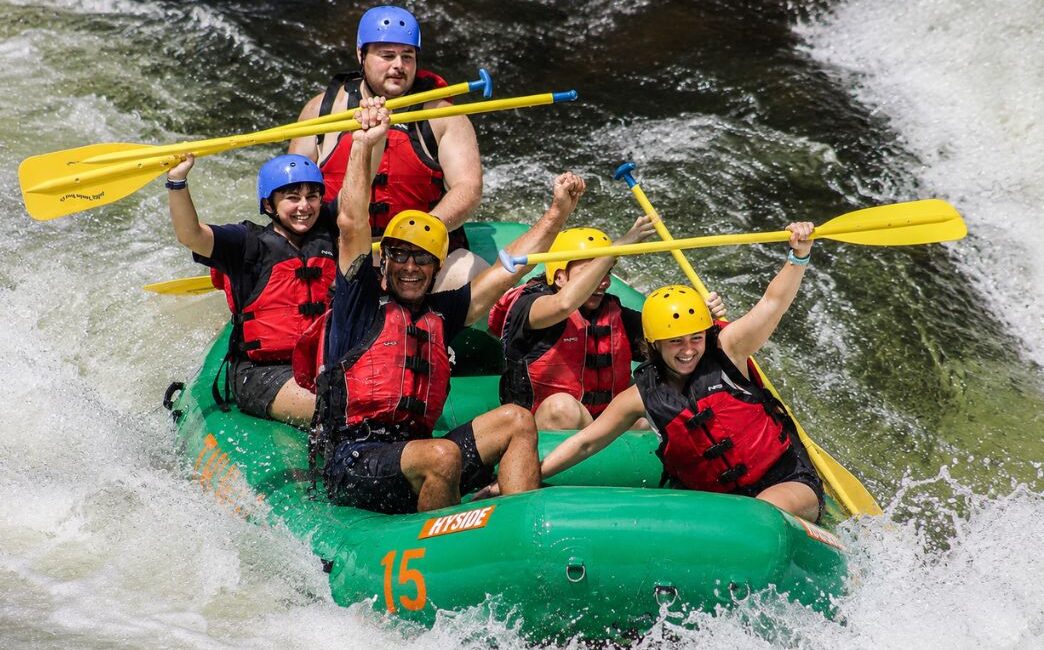 family going through a rapid on the Nantahala River